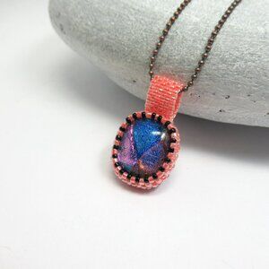 Handstitched glass pendant